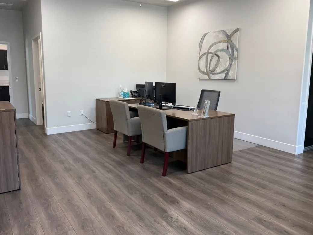 Clean office workspace with desk and seating, professionally cleaned by Scrubhub Cleaning in Clovis, CA