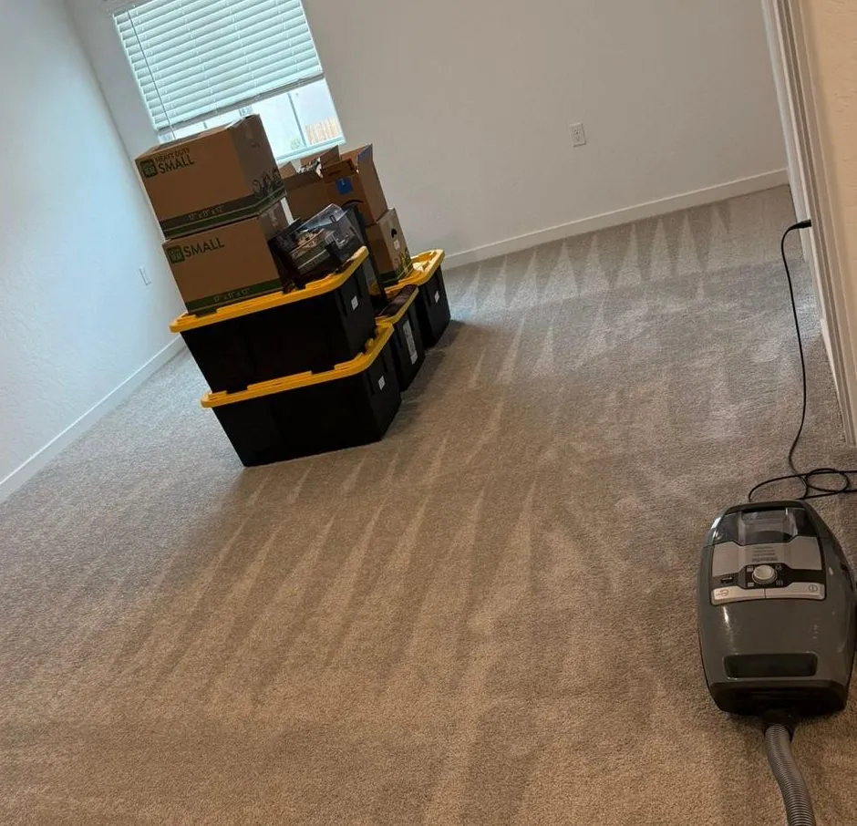 Freshly vacuumed carpet and packed moving boxes during a move-out clean by Scrubhub Cleaning in Clovis, CA